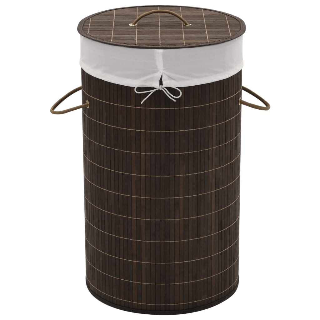 Dark brown round bamboo laundry hamper with a removable liner and sturdy handles.
