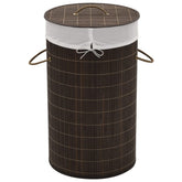 Dark brown round bamboo laundry hamper with a removable liner and sturdy handles.