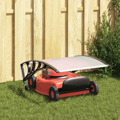Black and silver robot lawn mower garage roof sheltering a red mower on grass.