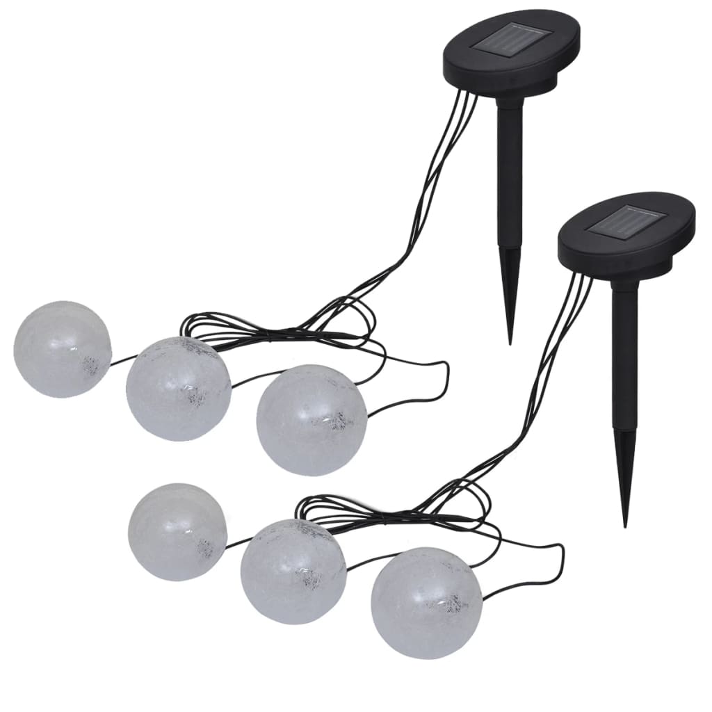 Two sets of three white solar LED ball lights with black ground spikes.