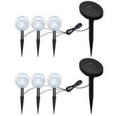 Six-pack of solar LED ball garden lights with frosted glass orbs and black spikes.