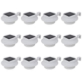 12-pack of white outdoor solar LED fence lights with mounting brackets.