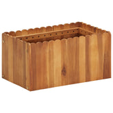 Rectangular raised garden bed made of solid acacia wood with scalloped edges.