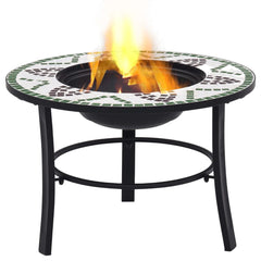 Round green mosaic ceramic fire pit with flames burning in the center bowl on a black metal stand.