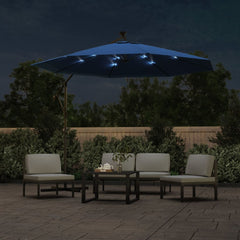 Azure cantilever garden parasol with LED lights over patio furniture at night.