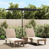 Black rectangular garden parasol with aluminum pole, 6.6'x4.9', providing shade over beige lounge chairs.
