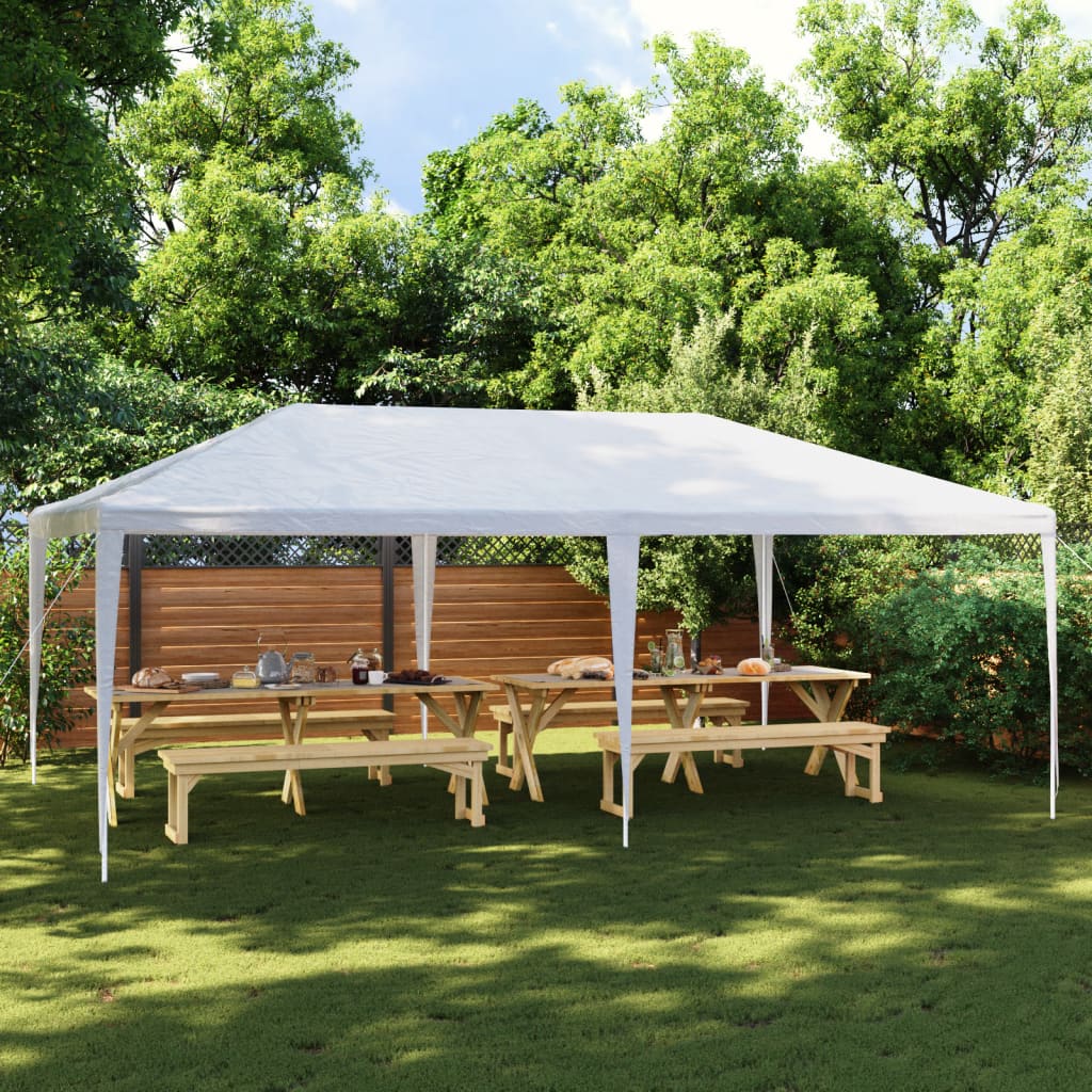 White 13.1'x19.7' party tent with UV water-resistant canopy set up in a green backyard with wooden picnic tables.