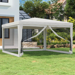 A white 13.1x13.1 ft party tent with mesh sidewalls set up on a grassy lawn near a modern house.