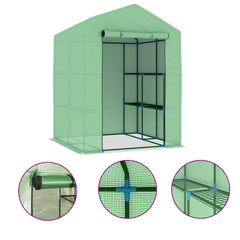 Green steel greenhouse with shelves and a rolled-up front door.