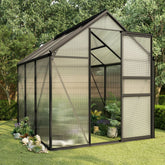 Anthracite aluminum greenhouse with polycarbonate panels and open door amid plants and greenery.