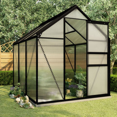 Anthracite aluminum greenhouse with base frame and translucent polycarbonate panels outdoors.