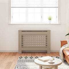 Gray MDF radiator cover with slatted design in a living room, placed over a baseboard heater.