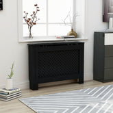 Black MDF radiator cover with slatted design, measuring 44.1x7.5x32.1 inches, in a modern living room.