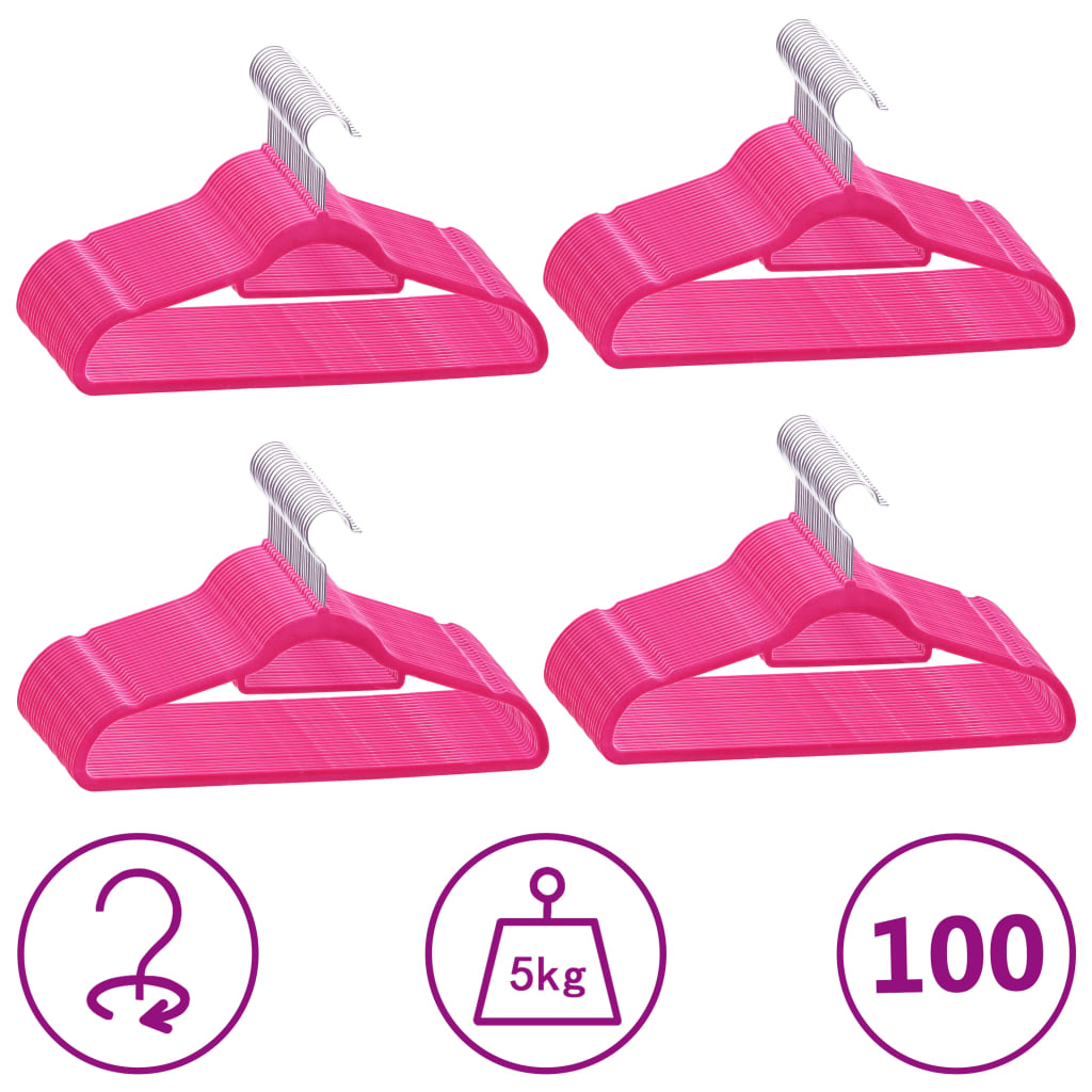 Set of 100 pink velvet anti-slip clothes hangers with swivel hooks and trouser bars.