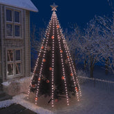 A Christmas tree is illuminated by warm white net lights and decorated with ornaments.