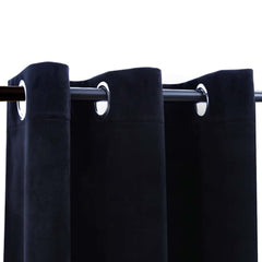 Black velvet blackout curtains with rings, two 37x84-inch panels, blocking light for privacy.