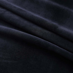Black velvet blackout curtains with rings, each panel measuring 37x84 inches.
