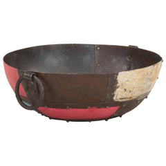 Rustic iron fire pit with colorful patina and side handles, 15.7-inch diameter.