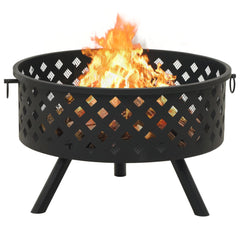 Black steel fire pit with burning logs, mesh cover, poker, and tripod legs.