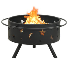 Black steel fire pit with star and moon cutouts, mesh cover, poker, and burning fire inside.