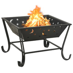 Black steel fire pit with crescent moon and star cutouts, burning flames inside 24.4-inch bowl on legs.