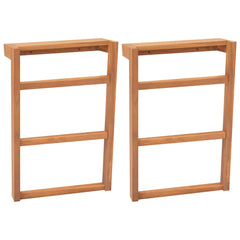 Set of two solid teak wood towel racks with three rails each.