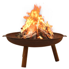 Brown rustic steel fire pit with burning logs in a round bowl on four legs.