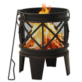 A rustic black-brown steel fire pit with a mesh body and burning logs, with a poker.