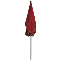 Bordeaux red garden parasol with UV protection, black pole, and tilted canopy.