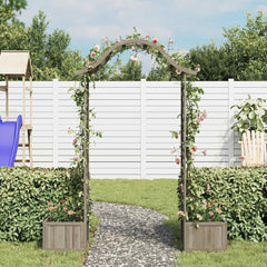 Gray wooden garden pergola with integrated planters, covered in pink climbing roses, set in a lush backyard.