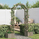 Gray firwood garden pergola with integrated planters, covered in pink climbing roses in a backyard setting.