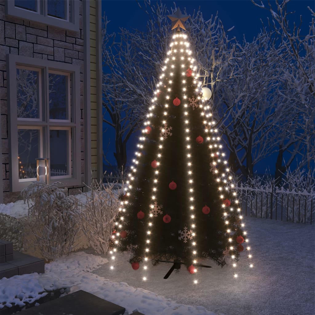 A net of 300 cold white LEDs designed to drape over a 10-foot Christmas tree, shown lit up outdoors at night.