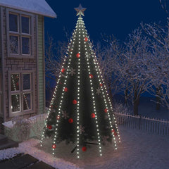 500 cold white LED Christmas tree lights draped on a snowy outdoor tree at night.