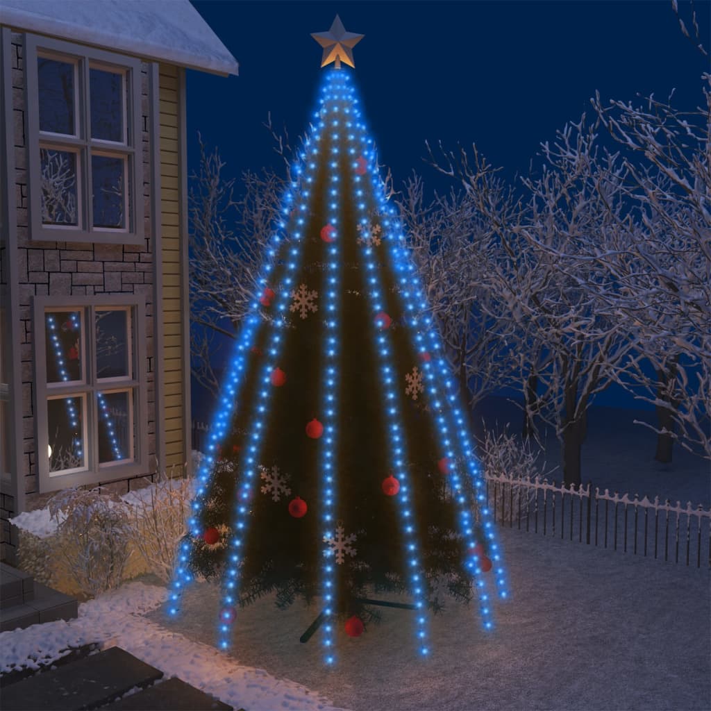 Blue LED Christmas tree lights with 500 bulbs illuminating a snowy outdoor tree at night.