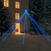 A 16ft blue LED Christmas tree with 800 lights stands in a snowy yard at night.