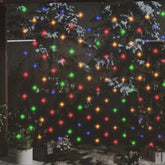 Blue LED net lights, 9.8 by 6.6 feet with 204 LEDs, draped over snowy trees and plants outdoors.