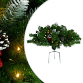 A 15.7-inch pre-lit artificial PVC Christmas pathway tree in green with berries, pinecones, and LED lights on a metal spike.