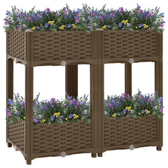 Brown polypropylene raised garden bed with two shelves and flowers planted inside