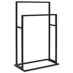 A black iron, two-tier freestanding towel rack is shown against a white background.