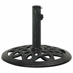 Green cast iron umbrella base with decorative scrollwork and adjustable pole holder.