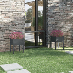 Two gray solid pine wood garden planters with pink flowers flank a modern stone house exterior.