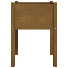 Honey brown solid pine wood raised flower bed with ample space for deep soil and plants.