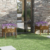 Two honey brown solid pine wood garden planters with purple flowers flank a glass door on a stone wall.