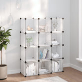 White 12-cube storage organizer with transparent doors and black frame, displayed in a bright room with books and decor.