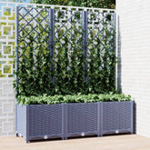 A blue-gray garden planter with a trellis is filled with green climbing plants.
