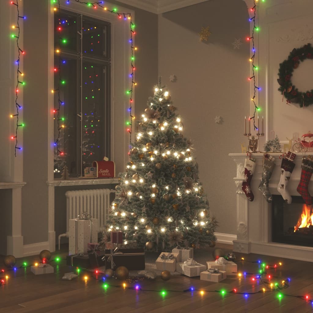Multicolor LED string lights draped around a Christmas tree and room with gifts and fireplace.