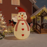 10 ft inflatable snowman with multicolor LEDs, red hat, scarf, and candy cane, displayed outdoors.
