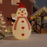 A 15-foot inflatable snowman with multicolor LED lights, red hat, scarf, and candy cane, displayed outdoors.