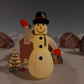 12ft inflatable LED snowman in white Oxford fabric, waving with scarf and hat in snowy yard.