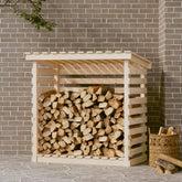 A wooden pine firewood rack holding stacked logs against a brick wall.
